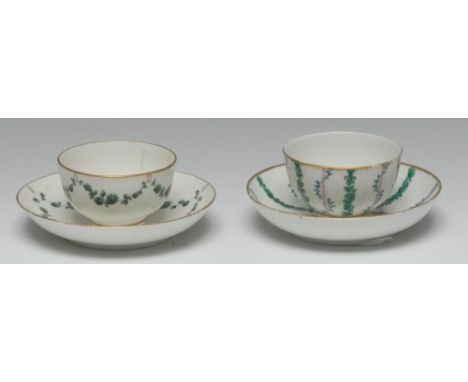A Chelsea-Derby tea bowl and saucer, painted en green, turquoise and puce camaïeu with tumbling bellhusks and laurel entwined