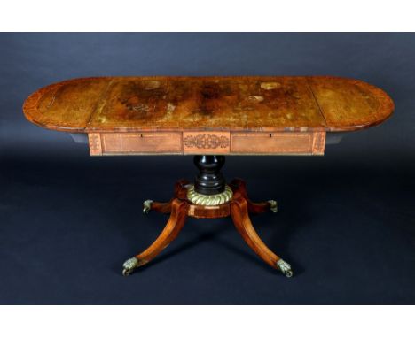 A Regency gilt metal mounted rosewood and marquetry sofa table, rounded rectangular top with fall leaves outlined with a broa