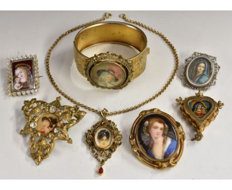 Jewellery - a continental silver painted Madonna brooch, blue robes, red smock, filigree frame, stamped 800; another, Madonna
