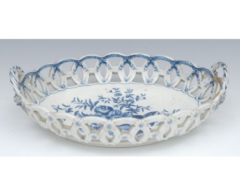 A Worcester Pine Cone pattern shaped oval basket, printed in underglaze blue with peony between two pine cones and a pomegran
