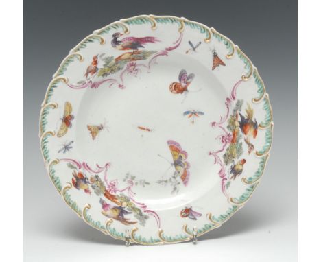 A Chelsea-Derby silver-shape plate, painted in colourful enamels with butterflies and winged insects, broad band with reserve