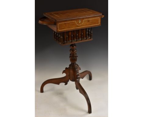 A 19th century Anglo-Indian hardwood pedestal work table, hinged cover enclosing a lift-out tray and an arrangement of compar