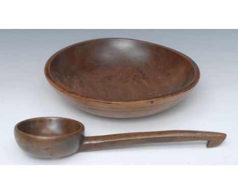 A 19th century turned sycamore bowl, 33cm diam; a similar ladle, 36cm long (2)