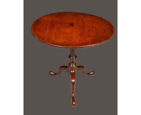 A George III mahogany tripod supper table, circular top tilting on a birdcage support, turned urnular column, cabriole legs, 