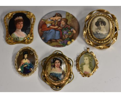 A 19th century oval mourning brooch, central revolving photographic and black panelled section, within triple layer ornate gi