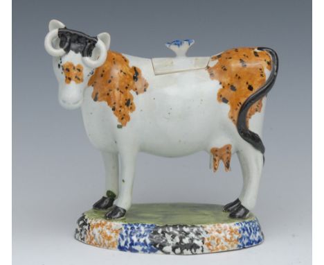 A 19th century Staffordshire Pearlware cow creamer, standing four square, tan patch markings with black dots, oval base spong