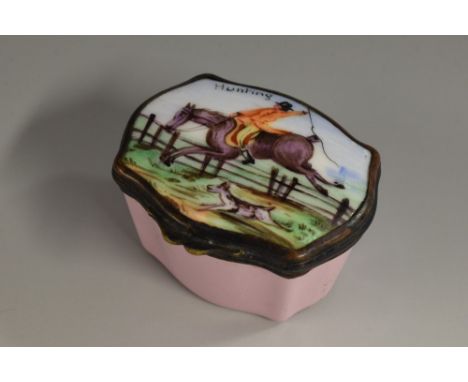 A 19th century enamel commode shaped snuff box, hinged cover inscribed Hunting and painted with a mounted huntsman clearing a