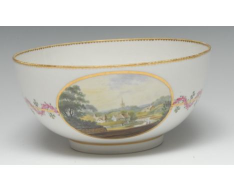 A Derby circular slop basin, pattern 366, painted in polychrome with an English village, in a gilt oval reserve, flanked by a
