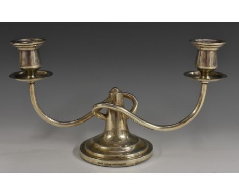 A Chinese silver two-light table candelabrum, campana sconces, stepped circular base, 28cm wide, Wai Kee, Hong Kong