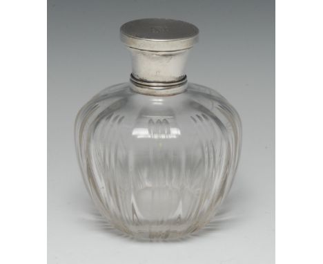 A large early 20th century silver mounted scent bottle, engine turned cover centred by a vacant Rococo Revival cartouche and 