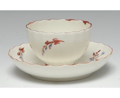 A Pinxton straight-fluted tea bowl and saucer, pattern 1, red sprig version, iron red borders, the tea bowl 5.5cm high and im