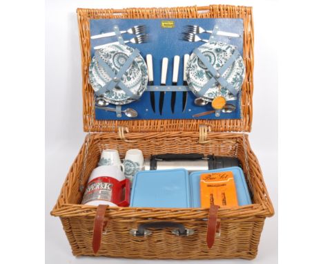 A retro vintage mid 20th Century British Brexton picnic hamper case. Complete with original knives, forks, tea cups, side pla