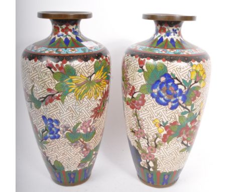 A pair of early 20th Century 1920s / 1930's Chinese Cloisonne vases. Baluster form with polychrome enamel decoration depictin