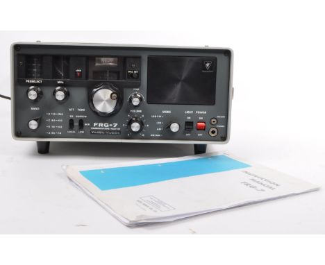 A vintage 20th century circa 1970s Yaesu Musen FRG-7 communications receiver. With carry handle to side, with instruction and