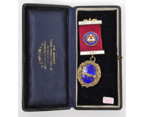 A 20th century silver hallmarked masonic jewel. The medal having gilt metal enamelled top bar and suspension reading Past Arc