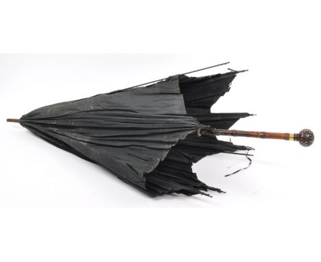 A 19th century Victorian era inlaid pique-work umbrella. The umbrella having inlaid pique handle inlaid yellow metal with sta