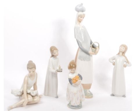 A collection of five vintage 20th century Nao Spanish porcelain figurines by Lladro. Lotto include; Girl with candle, girl wi