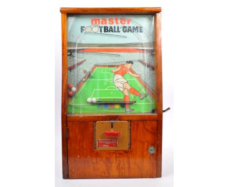 Fairground / Arcade: An original vintage Mastermatic made ' Master Football Game ' penny arcade slot machine. Wooden cabinet,