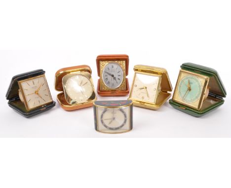 A collection of six 20th Century vintage travel clocks to include five in collapsable leather cases, and miniature clock with