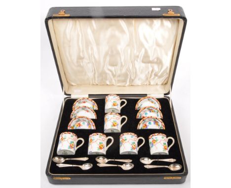 A Circa 1930s Royal Doulton boxed set of six coffee cans and saucers in ' Spring ' pattern along with 6 spoons, all set withi