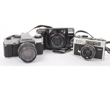 A collection of vintage 20th century 35mm film cameras. Included within this collection is an Olympus OM20 SLR (Serial Number