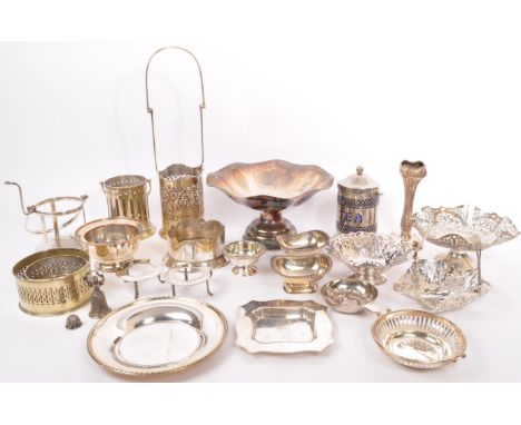 A collection of vintage 20th century silver plated items. To include pierced wine bottle carrier, bon bon dishes, bottle coas