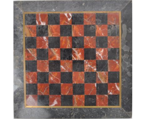 A 20th century marble &amp; alabaster chess board. The board having red &amp; black marble and alabaster squares with brass i