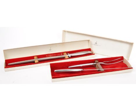 A vintage retro carving set by Gerber Legendary Blades, Germany comprising knife, fork and sharpening steel all cased in thei