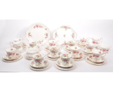 A collection of Royal Albert Bone China, Staffordshire, England part tea services to include cups, saucers, plates, creamer, 