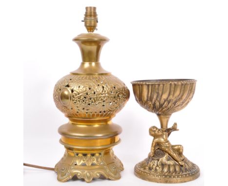 A vintage 20th century pierced brass Anglo-Persian table lamp having scrolled foliate and cartouche to body, together with a 