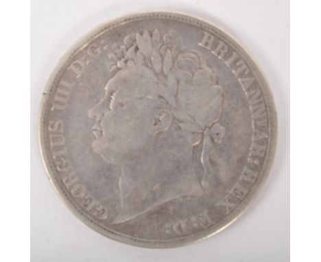 An early 19th century George III 1822 925 silver crown coin. The obverse shows a laureate head portrait of George II by Bened