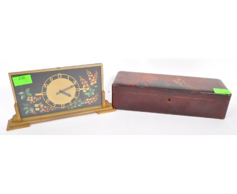 An early 20th century circa 1920s Art Deco hand painted mantel clock with gilt metal face and hand painted florals to either 