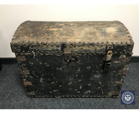 An antique pine dome top trunk