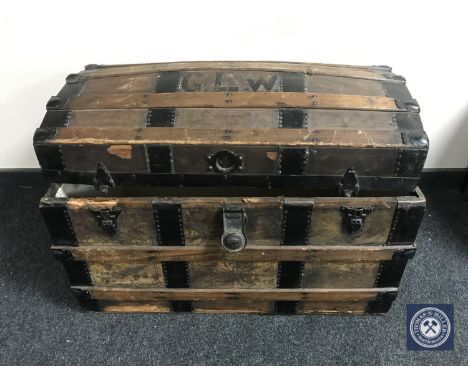 An early 20th century wooden bound dome top shipping trunk