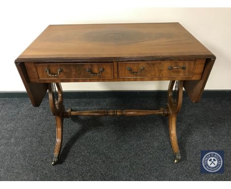 A mahogany sofa table fitted two drawers