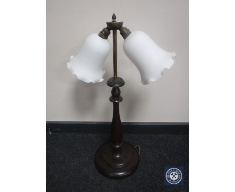 An early 20th century mahogany and brass two-way desk lamp