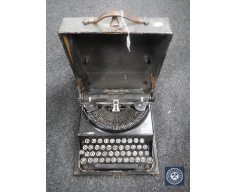 A cased vintage Remington Home Portable typewriter 