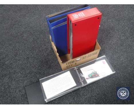 A box of two albums first day covers together with four folders of stamps of the world on sheets