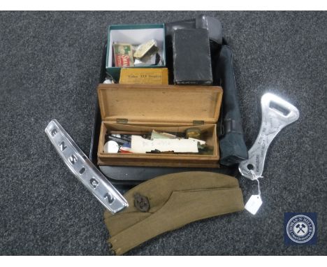 A tray containing collectable including wooden pen box and pens, Queen Elizabeth coronation medal, tins, coins, banknotes, ov