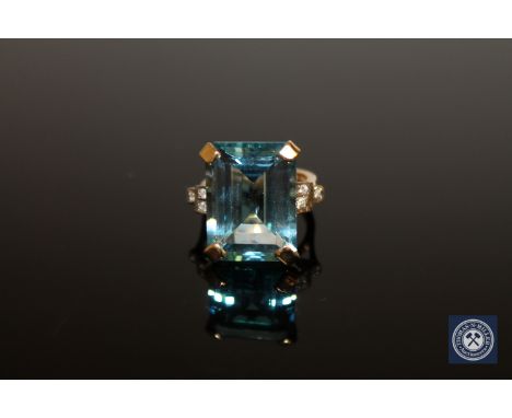 An 18ct gold topaz and diamond ring, size N