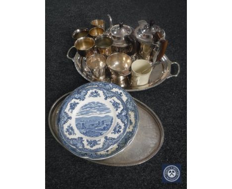 A four piece silver plated tea service on tray, gallery tray, plated goblets, commemorative mug, Johnson Brothers dinner plat