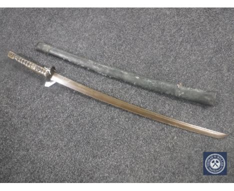 A copy of a Japanese WWII katana in leather scabbard