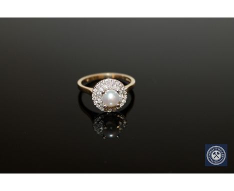 A 9ct gold pearl and diamond cluster ring, 