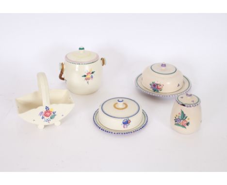A Poole pottery biscuit barrel, with wicker handle; a Poole pottery preserve jar; two butter dishes and a posy basket, (5)