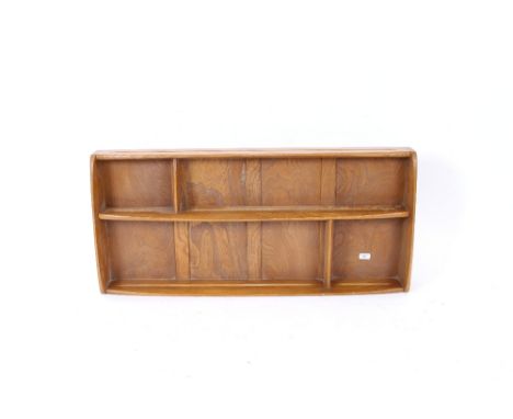 A light Ercol plate rack, 108cm wide