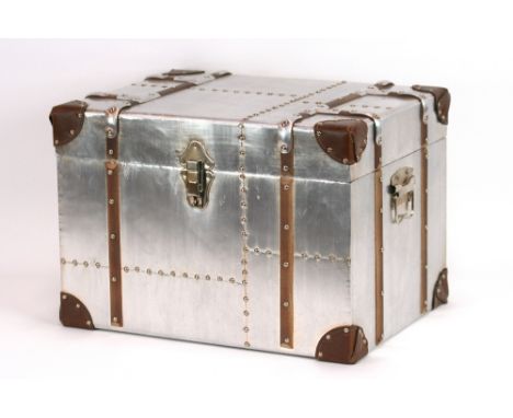 An aluminium, leather and stud decorated trunk, 44cm wide
