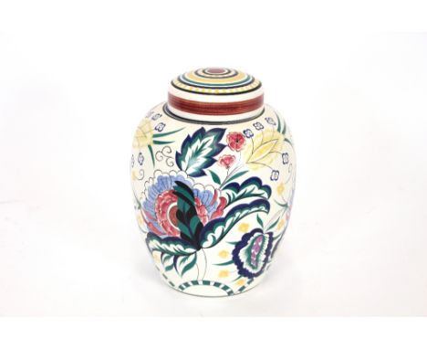 A Poole pottery vase and cover, with profuse floral decoration, 26cm high