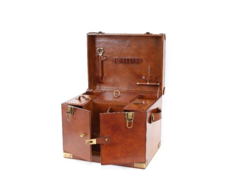 A large leather and brass mounted picnic hamper, 45.5cm wide x 37cm high