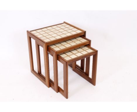 A nest of three G plan style teak and tile top coffee tables, 47cm wide in extremes