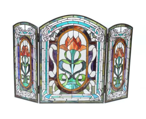An Art Nouveau design stained leaded glass triple fire screen